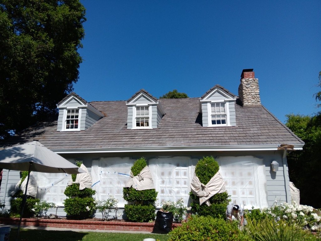 Home masked and prepped for exterior paint